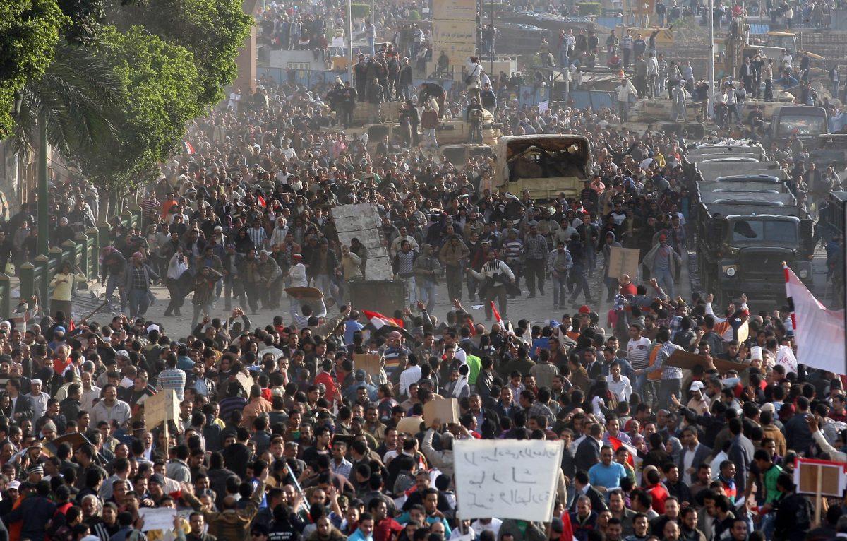 Egyptian anti-government demonstrators face pro-regime opponents in Cairo's Tahrir Square on Feb. 2, 2011. The revolt that eventually ousted President Hosni Mubarak is believed to have been partly financed through Qatar support for the Muslim Brotherhood. (STRINGER/AFP/Getty Images)