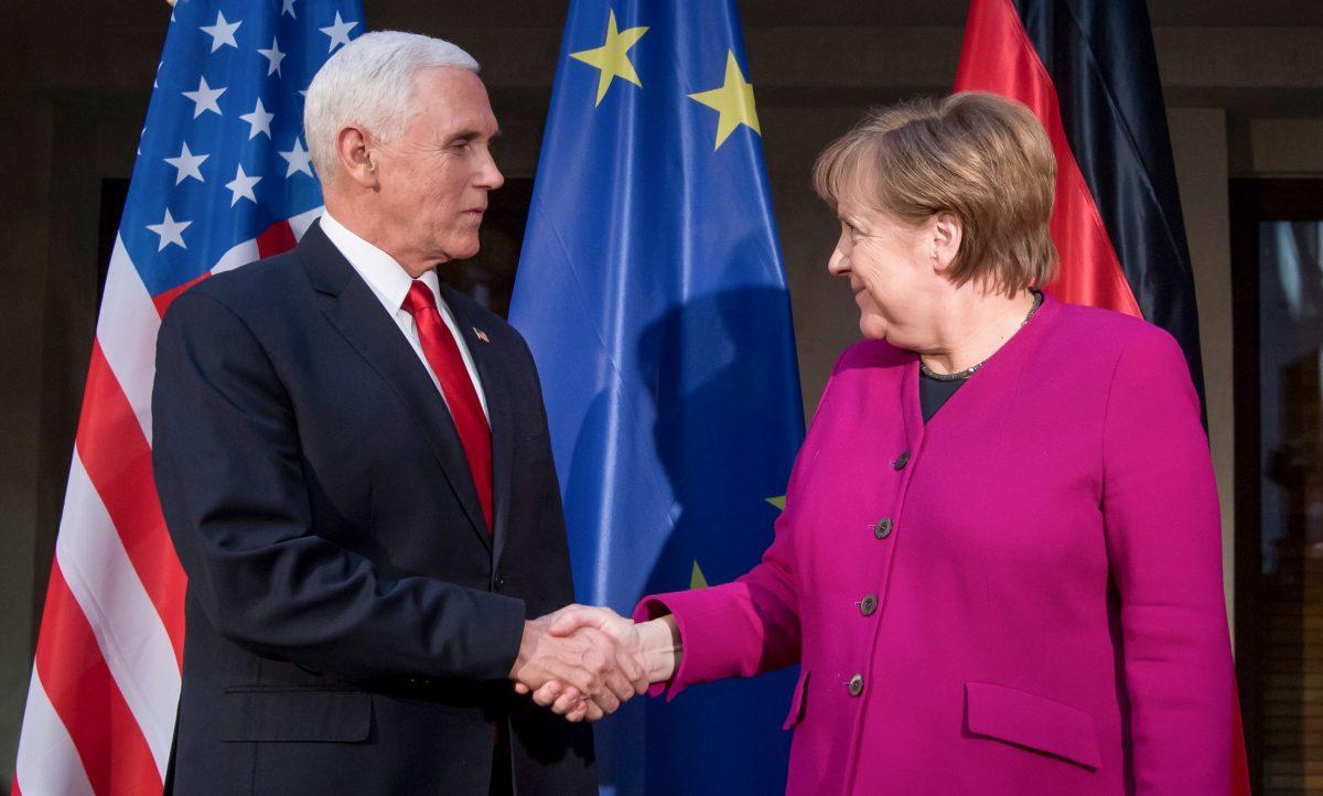 German Chancellor Angela Merkel (R) and US Vice President Mike Pence shake hands at a photo call during the 55th Munich Security Conference in Munich, southern Germany, on Feb. 16, 2019. (Sven Hoppe/AFP/Getty Images)