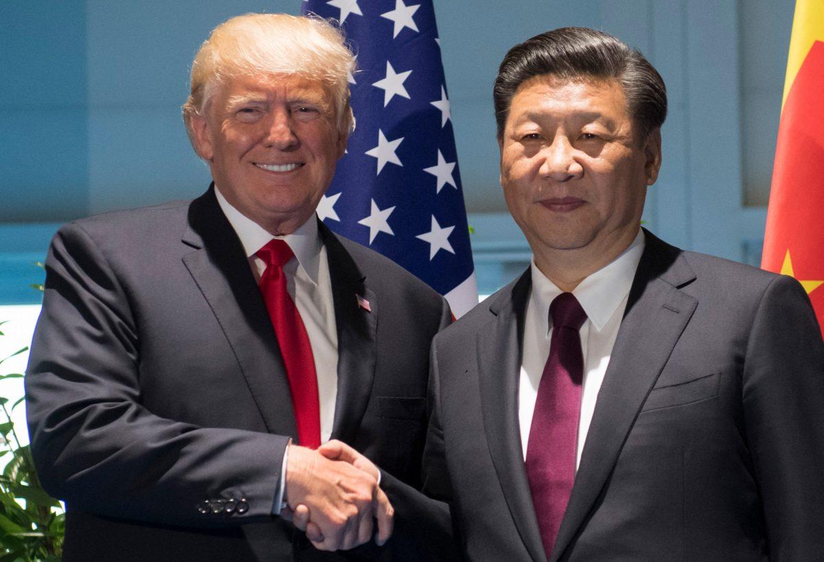 President Donald Trump and Chinese leader Xi Jinping shake hands prior to a meeting on the sidelines of the G-20 Summit in Hamburg, Germany, on July 8, 2017. (SAUL LOEB/AFP/Getty Images)