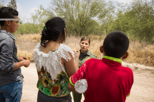 Marlene Castro, a supervisory Border Patrol agent, speaks to a group of unaccompanied minors who crossed the Rio Grande from Mexico into the United States in Hidalgo County, Texas, on May 26, 2017. (Benjamin Chasteen/The Epoch Times)