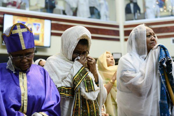 Members of the Ethiopian community take part in a special prayer for the victims of the Ethiopian Airlines flight ET302 crash, at the Ethiopian Orthodox Tewahedo Church of Canada Saint Mary Cathedral in Toronto, on March 10, 2019. (Christopher Katsarov/The Canadian Press via AP)