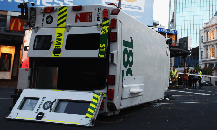 Ambulance Slammed by Taxi While En Route to Hospital, Flatbed Truck Finishes Journey