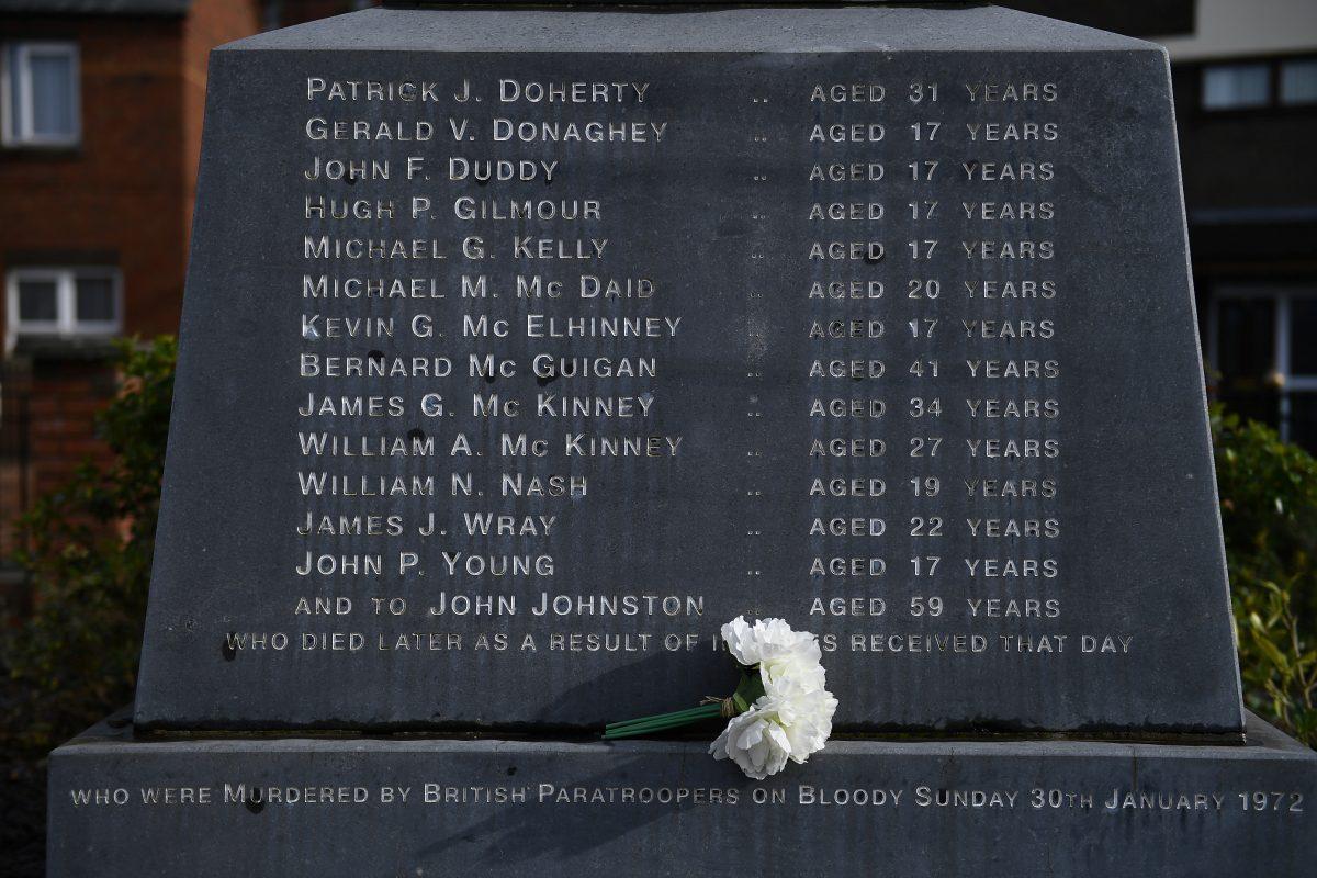 Flowers are left at the memorial for the people who died during Bloody Sunday, in Londonderry, Northern Ireland, on March 14, 2019. (Clodagh Kilcoyne/Reuters)