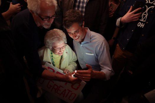 Democratic presidential candidate Beto O'Rourke poses for a selfie with a supporter during his first day of campaigning for the 2020 nomination at the home of Randy Naber March 14, 2019, in Muscatine, Iowa. (Chip Somodevilla/Getty Images)