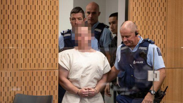 Brenton Tarrant, charged for murder in relation to the mosque attacks, is lead into the dock for his appearance in the Christchurch District Court, New Zealand, on March 16, 2019. (Mark Mitchell/New Zealand Herald/Pool via Reuters)