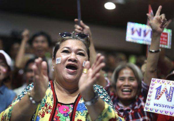 Supporters of Pheu Thai Party react after unofficial results during the general election in Bangkok on March 24, 2019. (Athit Perawongmetha/Reuters)