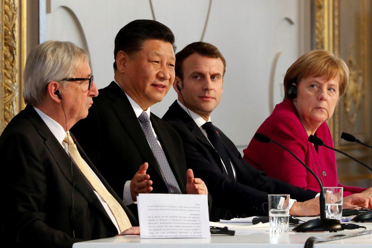 European Commission President Jean-Claude Juncker, Chinese leader Xi Jinping, French President Emmanuel Macron, and German Chancellor Angela Merkel hold a news conference at the Elysee presidential palace in Paris on March 26, 2019. (Thibault Camus/Pool via Reuters)