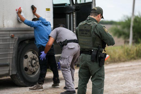 Border Patrol agents apprehend illegal aliens who have just crossed the Rio Grande from Mexico into Penitas, Texas, on March 21, 2019. (Charlotte Cuthbertson/The Epoch Times)