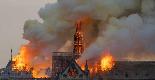 Smoke billows as flames burn through the roof of the Notre-Dame de Paris Cathedral in Paris, on April 15, 2019. (Fabien Barrau/AFP/Getty Images)