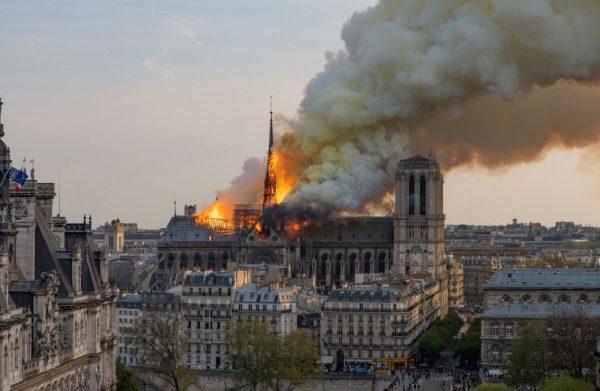 Smoke billows as flames burn through the roof of the Notre Dame de Paris cathedral in Paris, France, on April 15, 2019. (Fabien Barrau/AFP/Getty Images)