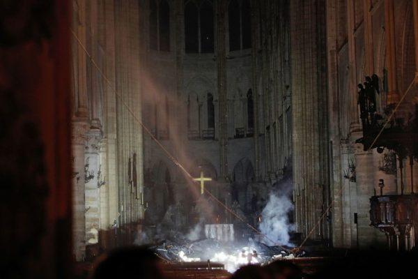 Smoke rises in front of the altar cross at Notre-Dame Cathedral in Paris, France, on April 15, 2019. (Philippe Wojazer/AFP/Getty Images)
