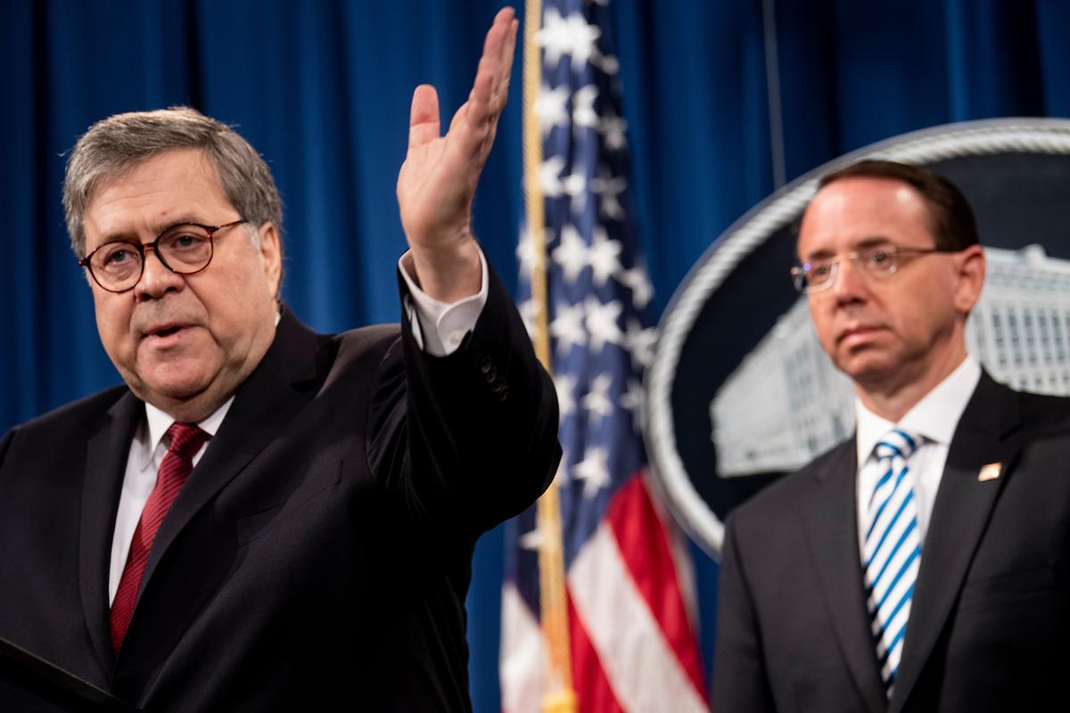 Deputy Attorney General Rod Rosenstein (R) listens while Attorney General William Barr speaks during a press conference about the release of the Mueller Report at the Department of Justice in Washington on April 18, 2019. (Brendan Smialowski/AFP/Getty Images)