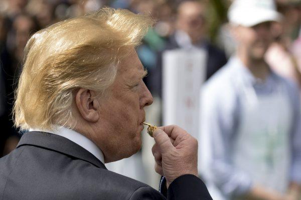 President Donald Trump blows the whistle to start a race during the annual White House Easter Egg Roll on the South Lawn of the White House, in Washington, on April 22, 2019. (Andrew Harnik/AP Photo)