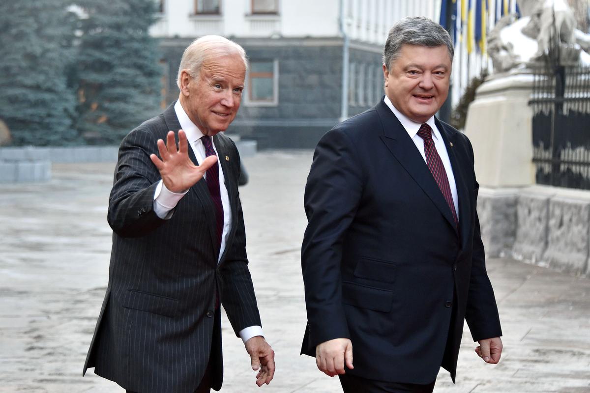 Then-Vice President Joe Biden arrives for a meeting with then-Ukrainian President Petro Poroshenko in Kyiv on Jan. 16, 2017. Biden bragged in 2018 that he threatened to withhold $1 billion in aid from Ukraine unless Poroshenko ousted the country's top prosecutor. (Genya Savilov/AFP/Getty Images)