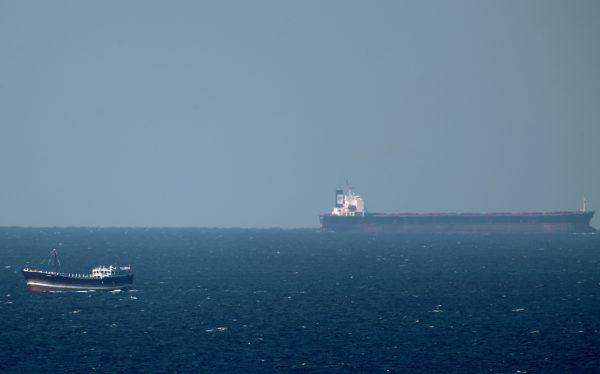 An oil tanker cruises towards the Strait of Hormuz off the shores of Khasab in Oman on Jan. 15, 2011. (Marwan Naamani/AFP/Getty Images)