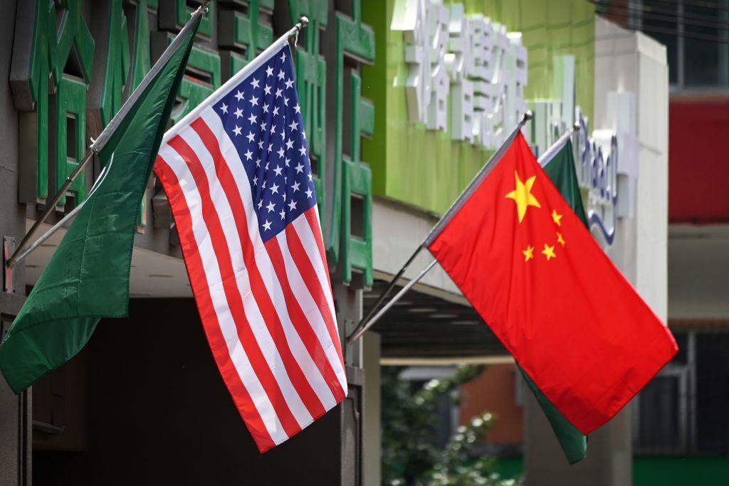 The U.S. and Chinese flags are displayed outside a hotel in Beijing on May 14, 2019. (GREG BAKER/AFP/Getty Images)