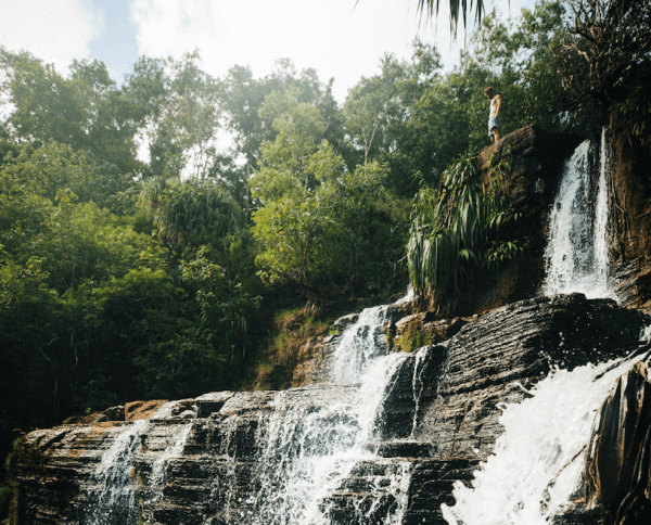 The mountainsides are streaked with waterfalls, many reachable from hiking trails. (Courtesy of Guam Visitors Bureau)