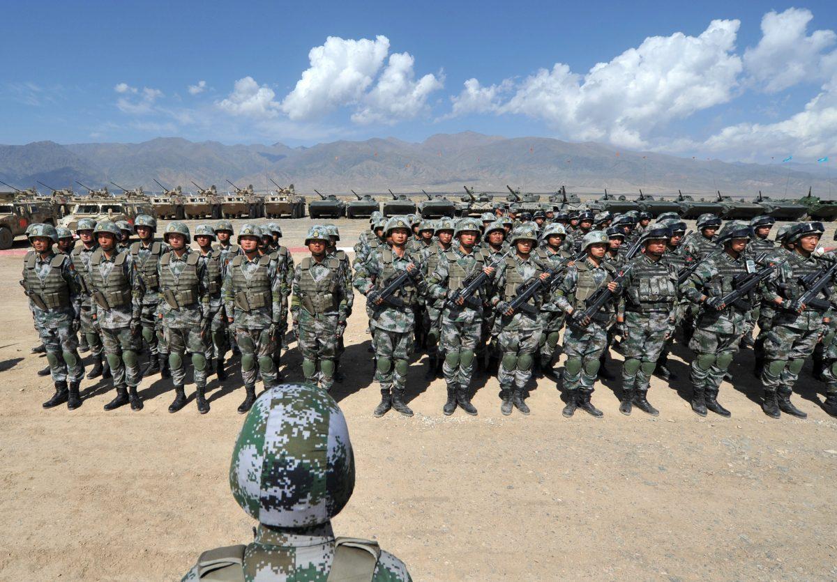Chinese soldiers stand at attention during Peace Mission-2016 joint military exercises of the Shanghai Cooperation Organization (SCO) in Balykchy, Kyrgyzstan, on Sept. 19, 2016.  (Vyacheslav Oseledko/AFP/Getty Images)