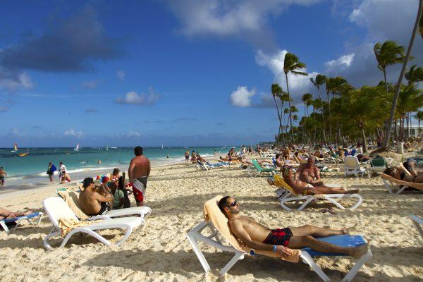 Tourists rest at Bavaro beach in Punta Cana, Dominican Republic, on Jan. 16, 2012. (Erika Santelices/AFP/Getty Images)