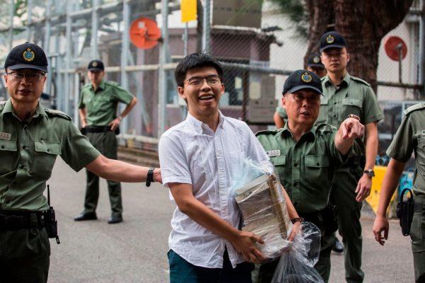 Hong Kong democracy activist Joshua Wong (C) leaves Lai Chi Kok Correctional Institute in Hong Kong on June 17, 2019. (ISAAC LAWRENCE/AFP/Getty Images)