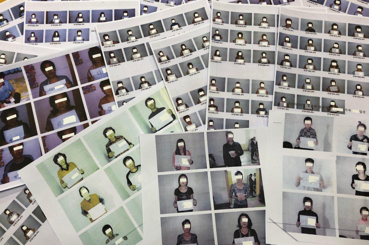 Photo sheets of the North Korean refugees helped by the North Korea Refugees Human Rights Association of Korea are displayed in Seoul, South Korea on June 11, 2019. (Josh Smith/Reuters)