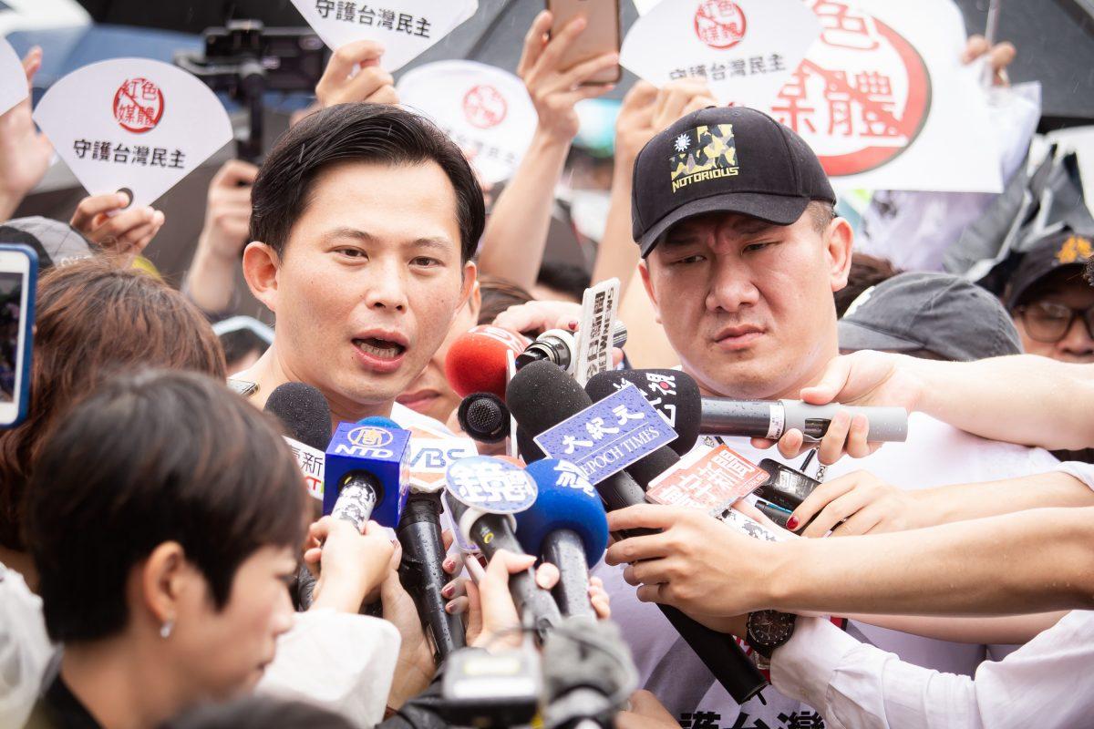 The co-organizers, Huang Kuo-chang (L) and Holger Chen (R) being interviewed by reporters after the mass rally in Taipei, Taiwan, on June 23, 2019. (Chen Po-chou/The Epoch Times)
