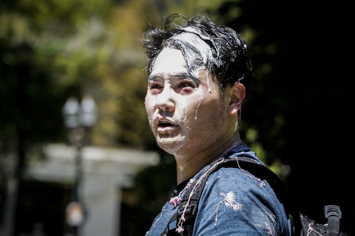 Andy Ngo, a Portland, Oregon-based journalist, is seen covered in an unknown substance after Antifa extremists assaulted him in Portland, on June 29, 2019. (Moriah Ratner/Getty Images)