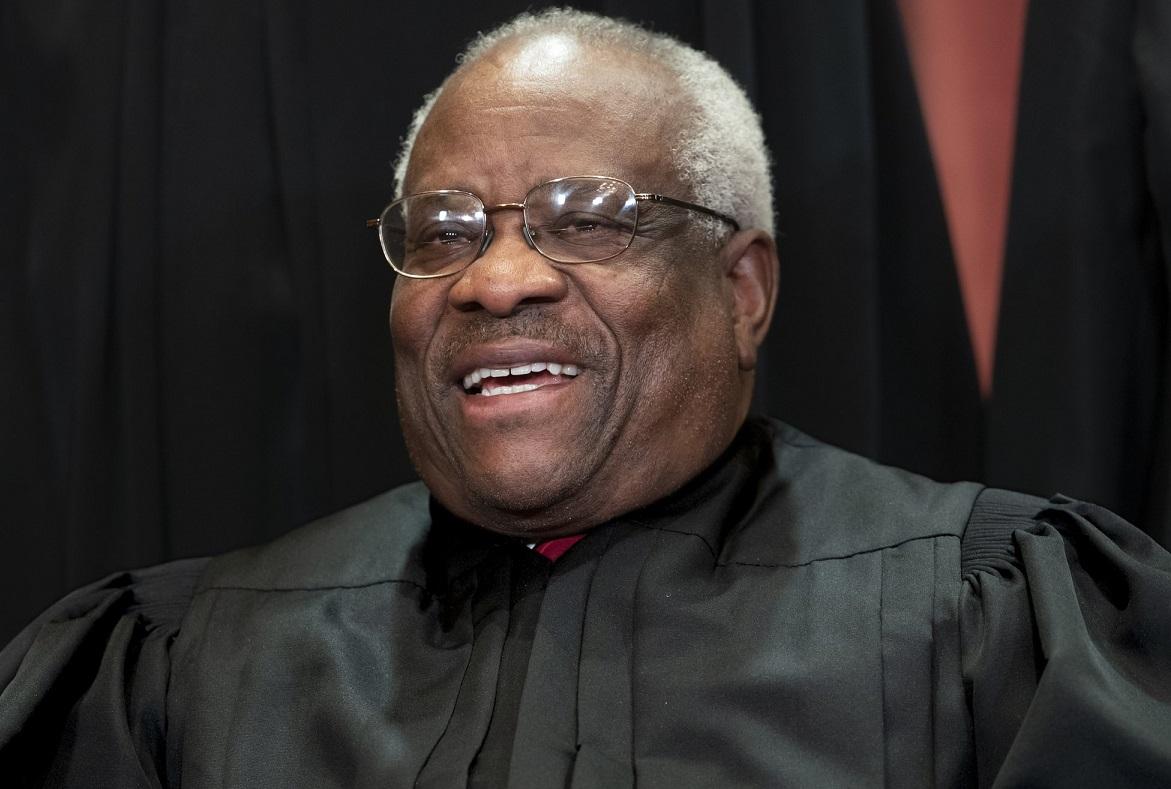 Supreme Court Associate Justice Clarence Thomas, appointed by President George H. W. Bush, sits with fellow Supreme Court justices for a group portrait at the Supreme Court Building in Washington, on Nov. 30, 2018. (J. Scott Applewhite/AP Photo)