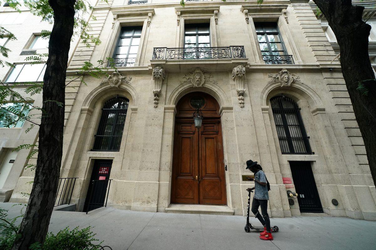 A man walks past the front door of the upper east side home of Jeffrey Epstein, after the Southern District of New York announced charges of sex trafficking of minors and conspiracy to commit sex trafficking of minors, in New York, July 8, 2019. (Carlo Allegri/Reuters)