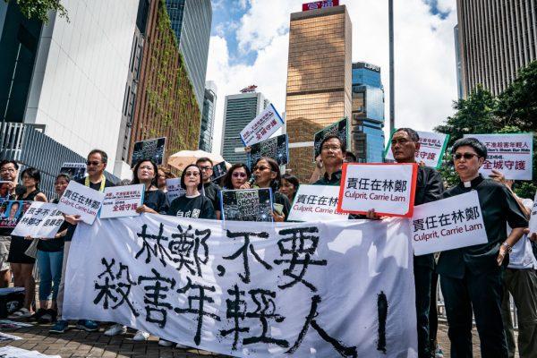 A parent group demonstrate outside the Chief Executive Office to speak with Carrie Lam, Hong Kong's chief executive, in Hong Kong on June 20, 2019. (Anthony Kwan/Getty Images)