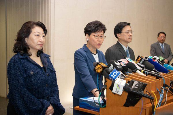 Hong Kong Chief Executive Carrie Lam (2nd L), Secretary for Justice Teresa Cheng (L), and Secretary for Security John Lee (3rd L) announce at a press conference that the government would press on with legislative debates on a controversial extradition bill, in Hong Kong on June 10, 2019. (Cai Wenwen/The Epoch Times)