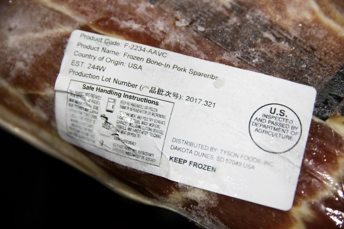 A label shows the origin of frozen pork that was imported from the U.S. at the Beijing barbeque restaurant Home Plate that specializes in U.S. meat, June 29, 2018. (Thomas Peter/Reuters)