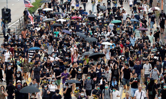 China Expert Warns Hongkongers Beijing Could Launch an Attack on Protesters at This Weekend’s Rally