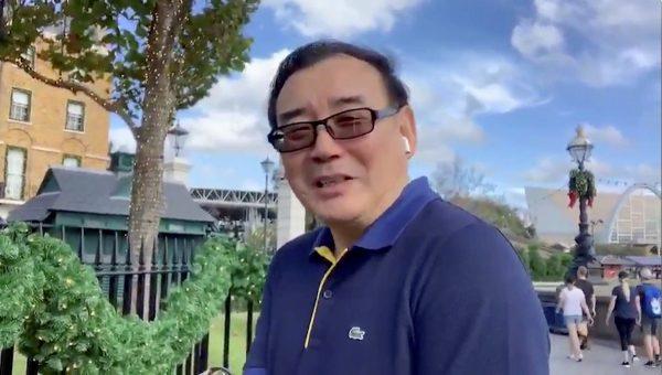 Australian writer Yang Hengjun wishes Happy New Year to his Twitter followers at an unidentified location in this still image from an undated video obtained via social media. (Twitter@yanghengjun via Reuters)