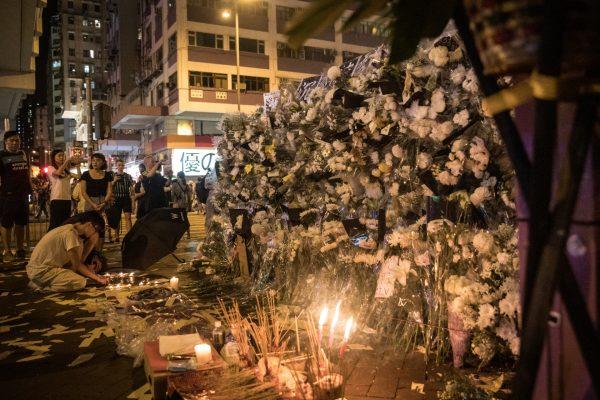People light candles at a tribute wall at the entrance to Prince Edward MTR station in response to police beatings in the train station on Aug. 31 in Hong Kong, on Sept. 07, 2019. (Chris McGrath/Getty Images)