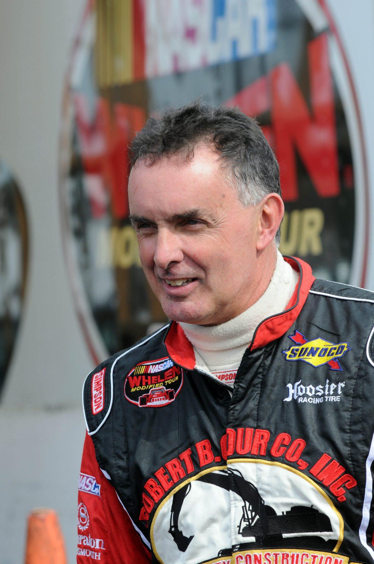 Mike Stefanik, a NASCAR legend, in the pits during practice and qualifying day at the Sunoco World Series 150 at Thompson Speedway in Connecticut on Oct. 19, 2013. (Darren McCollester/Getty Images for NASCAR)