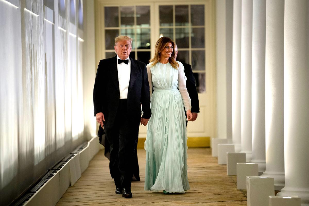 President Donald Trump, First lady Melania Trump, Australian Prime Minister Scott Morrison (partially hidden) and wife Jenny Morrison (not pictured) walk through the Colonnade to the Rose Garden for an Official Visit with a State Dinner at the White House on Sept. 20, 2019. (Brendan Smialowski/AFP/Getty Images)