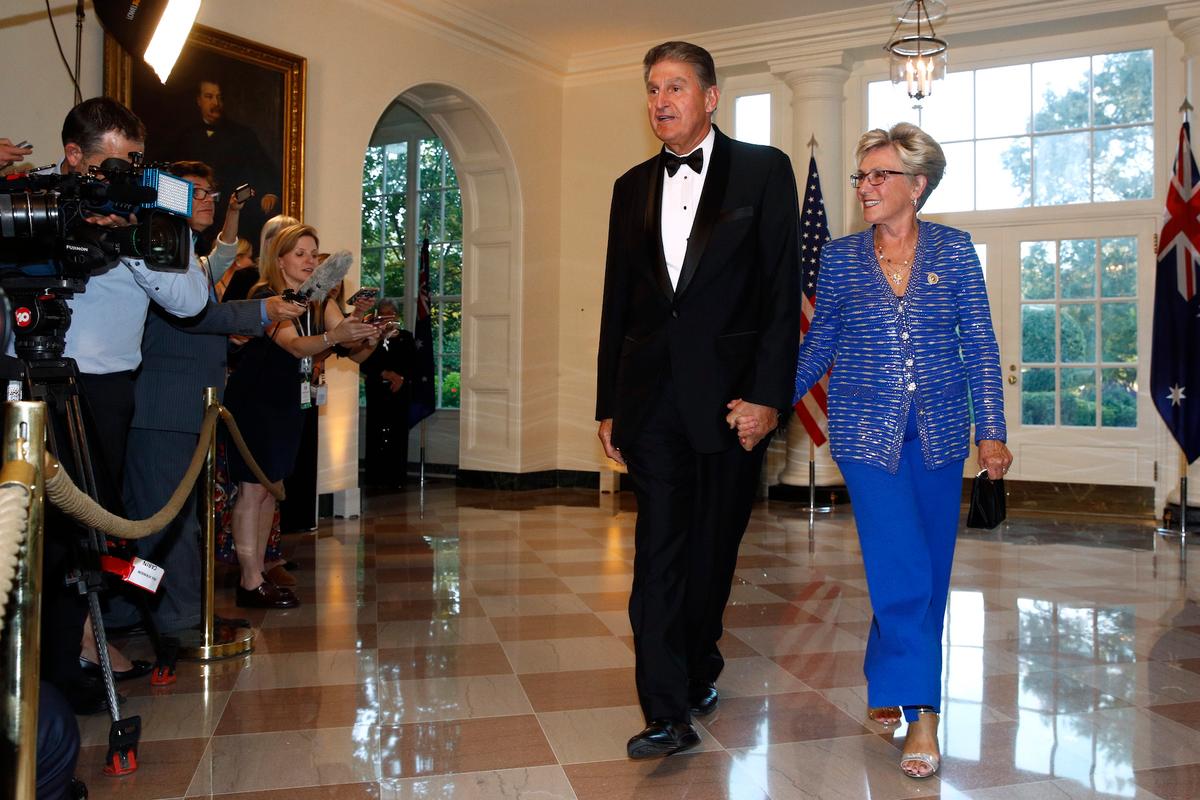 Sen. Joe Manchin, D-W.Va., left, and wife Gayle Conelly Manchin arrive for a State Dinner with Australian Prime Minister Scott Morrison and President Donald Trump at the White House, in Washington on Sept. 20, 2019. (AP Photo/Patrick Semansky)