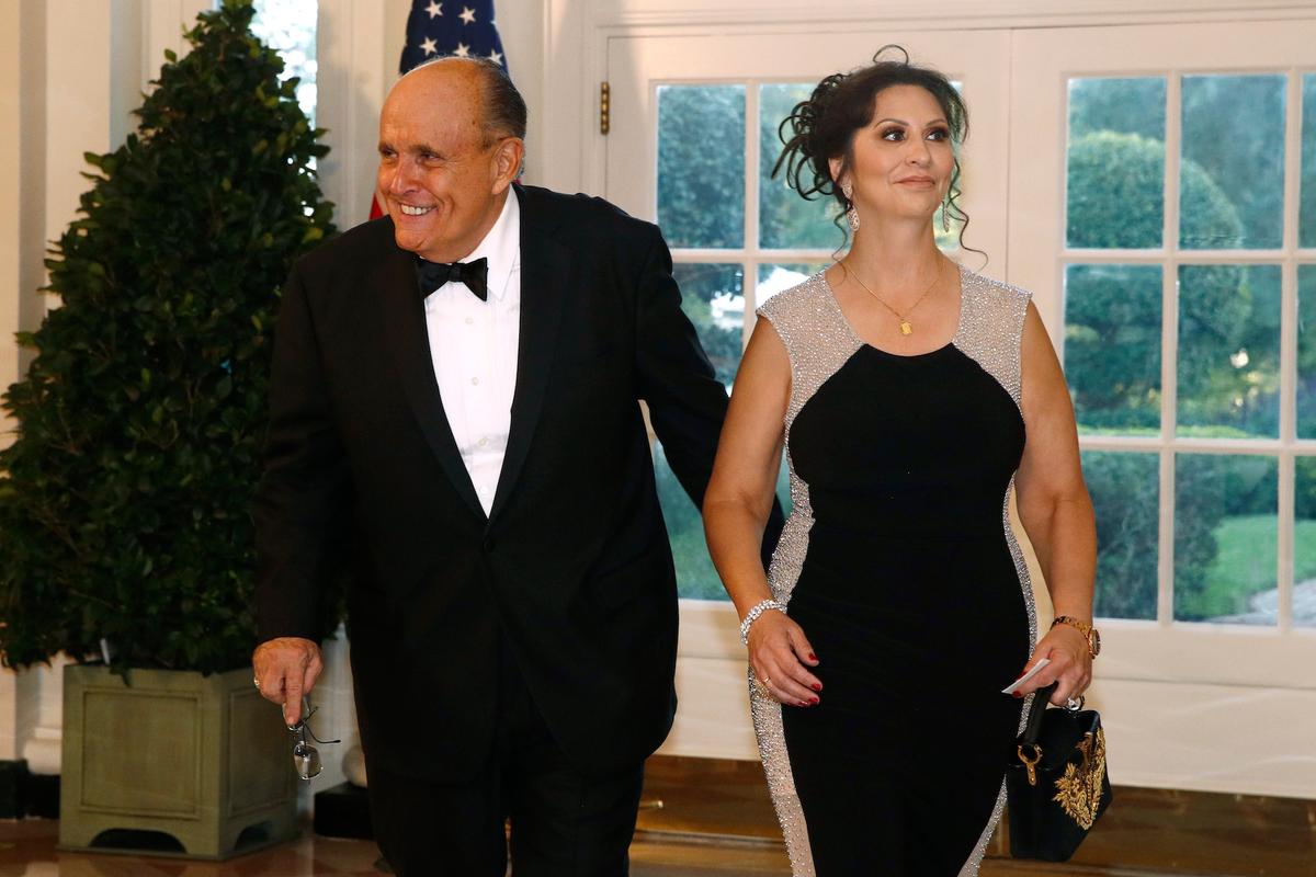 Rudy Giuliani, an attorney for President Donald Trump, and Maria Ryan arrive for a State Dinner with Australian Prime Minister Scott Morrison and President Donald Trump at the White House, in Washington on Sept. 20, 2019. (AP Photo/Patrick Semansky)