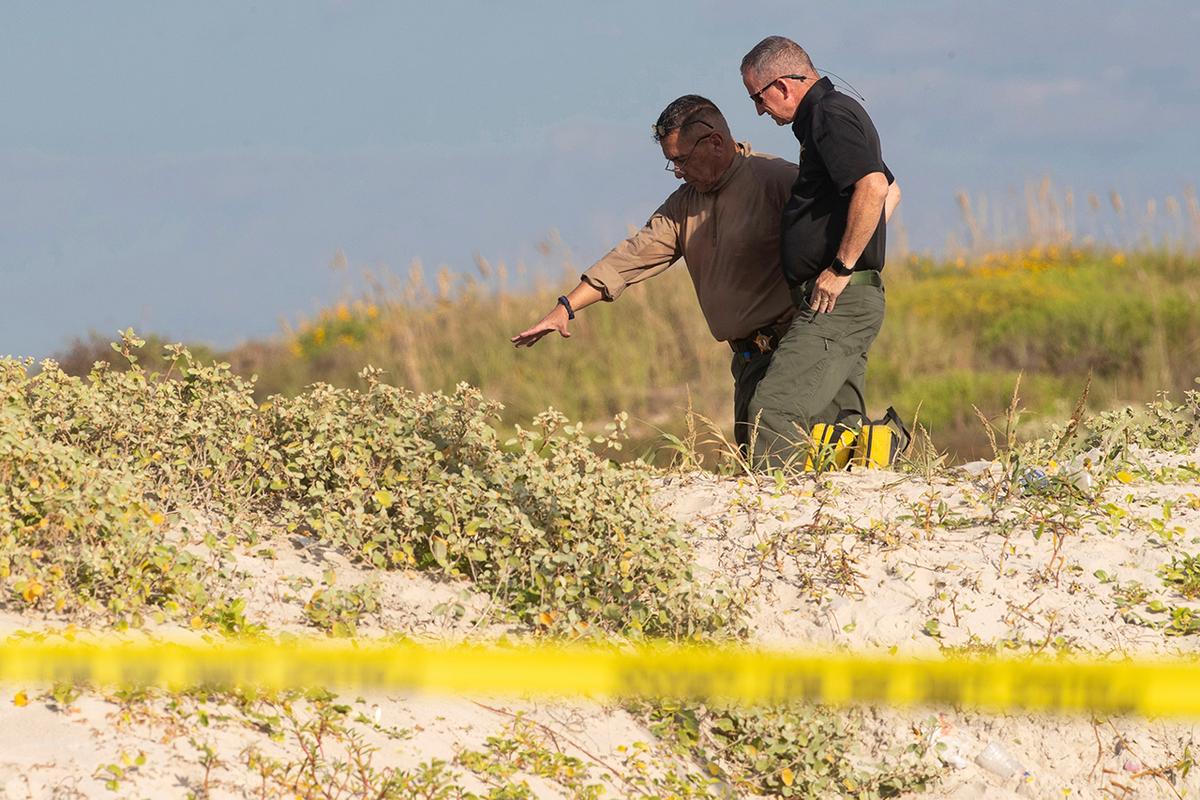 Several state agencies conduct an investigation after human remains were found on Padre Island in Kleberg County, Texas, on Oct. 28, 2019. (Courtney Sacco/Corpus Christi Caller-Times via AP, File)