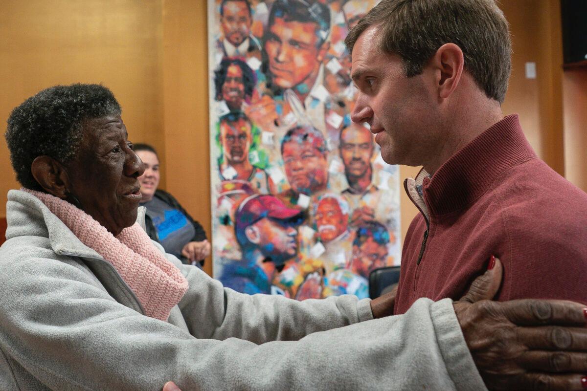 Kentucky Attorney General and Democratic gubernatorial candidate Andy Beshear speaks with Maddie Jones, of West Louisville, during a campaign stop at Southern Hospitality, in Louisville, Ky. on Nov. 5, 2019. (AP Photo/Bryan Woolston)