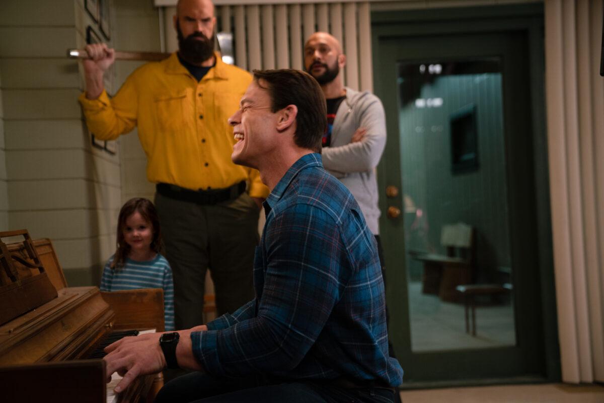 John Cena (C), and those in the background: (L–R) Finley Rose Slater, Tyler Mane, and Keegan-Michael Key in "Playing With Fire." (Doane Gregory/Paramount Pictures)