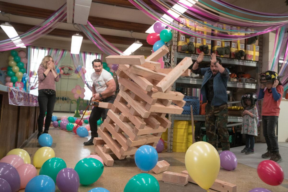 (L–R) Judy Greer, John Cena, John Leguizamo, Finley Rose Slater, and Christian Convery in "Playing With Fire." (Doane Gregory/Paramount Pictures)