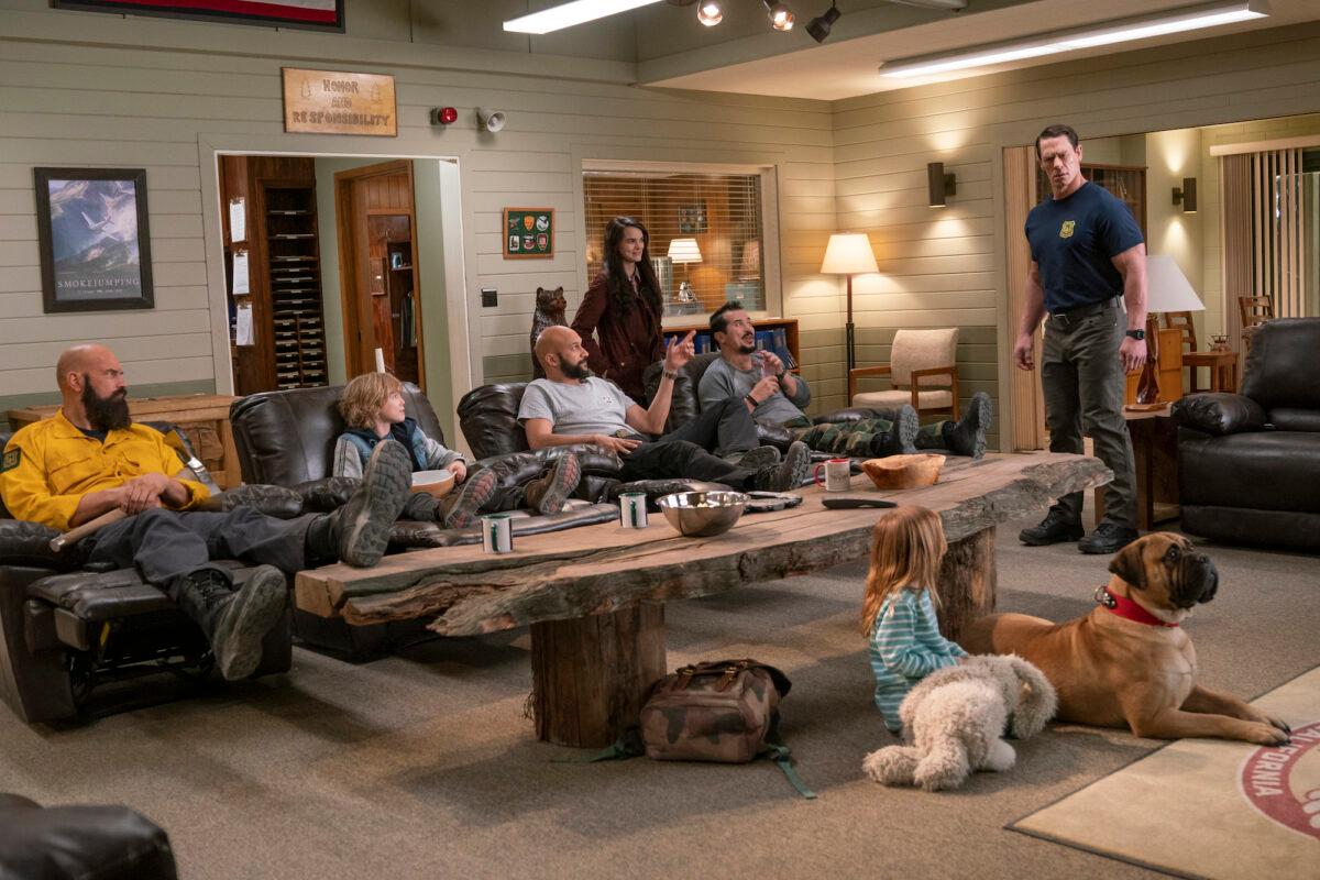 (L–R) Tyler Mane, Christian Convery, Keegan-Michael Key, Brianna Hildebrand, John Leguizamo, Finley Rose Slater (back to camera), and John Cena in "Playing With Fire." (Doane Gregory/Paramount Pictures)