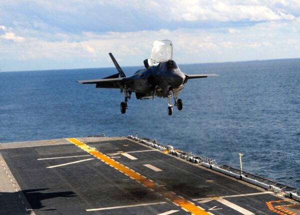 In this handout image provided by the U.S. Navy, an F-35B Lightning II makes the first vertical landing on a flight deck at sea aboard the amphibious assault ship USS Wasp in the Atlantic Ocean on Oct. 3, 2011. (Natasha R. Chalk/U.S. Navy via Getty Images)