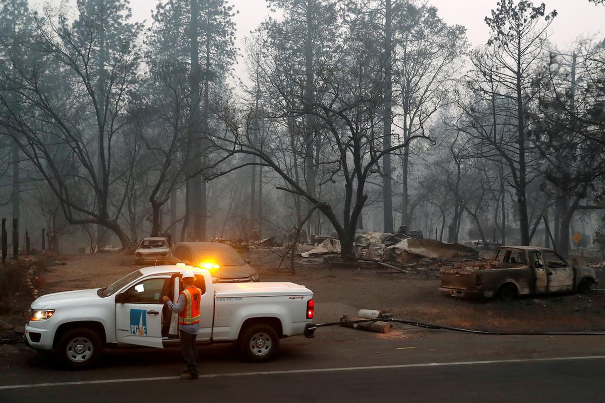 Employees of Pacific Gas & Electric (PG&E) work in the aftermath of the Camp Fire in Paradise, California on Nov. 14, 2018. (Terray Sylvester/Reuters)