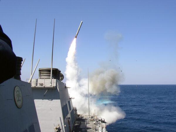 The guided-missile destroyer USS Porter launches a Tomahawk Land Attack Missile toward Iraq during the initial stages of shock and awe campaign on March 22, 2003. (Christopher Senenk/U.S. Navy/Getty Images)