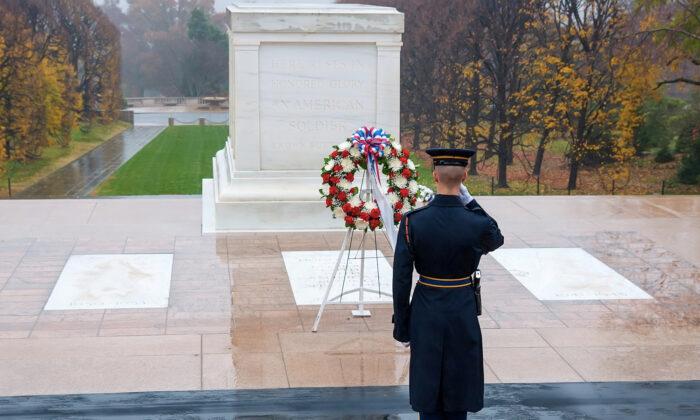 Patriotic Soldier Unfazed by Torrential Downpour Places Flag at Tomb of The Unknown Soldier