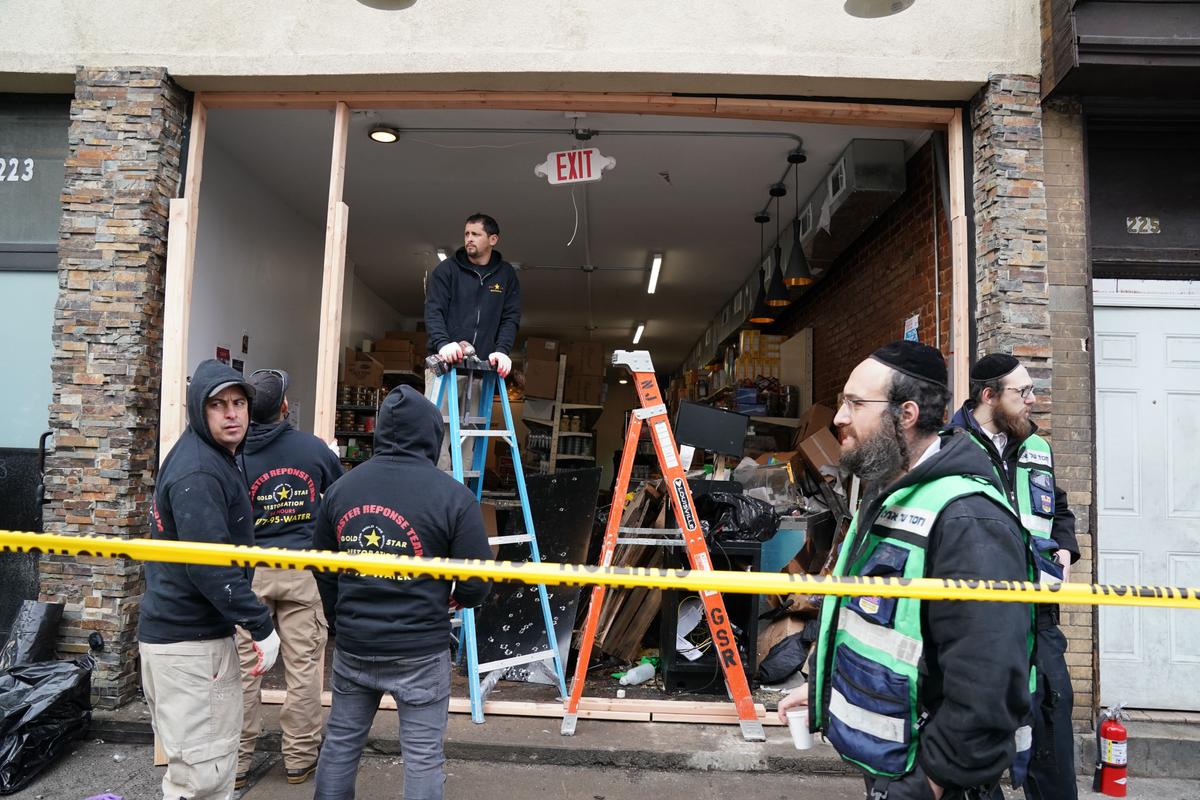 Demolition and recovery crews work at the scene of the Dec. 10, 2019, shooting at a Jewish grocery store in Jersey City, New Jersey on Dec. 11, 2019. (Bryan R. Smith/AFP via Getty Images)