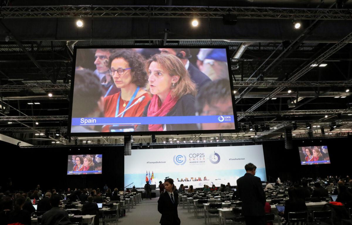 Spain's Energy and Environment Minister Teresa Ribera on the screen at a plenary session during the ongoing climate negotiations, which have reached a deadlock, in Madrid, Spain on Dec. 15, 2019. (Reuters/Nacho Doce)